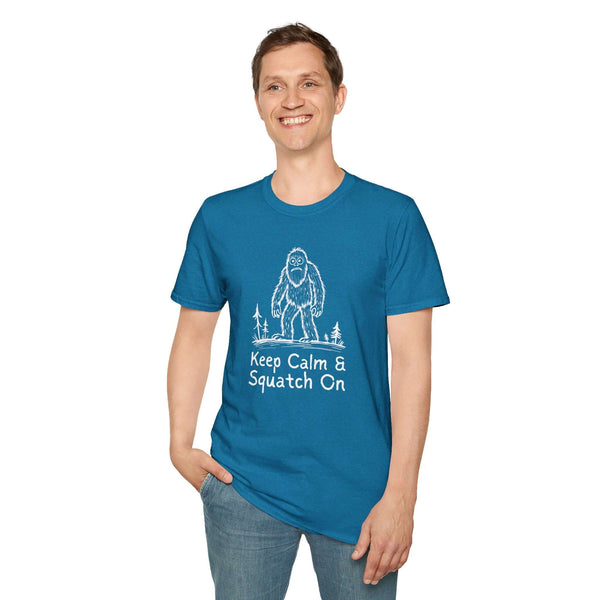Man wearing a blue Keep Calm & Squatch On t-shirt featuring a Bigfoot graphic.