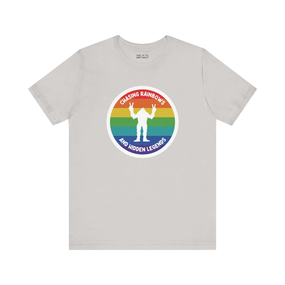 Chasing Rainbows Sasquatch Soft Tee Celebrate your roots with a splash of color and a touch of mystery in our "Hometown Pride" tee. Featuring a vibrant rainbow circle and a playful Sasquatch graphic, this shirt embodies the unique and spirited vibe of the