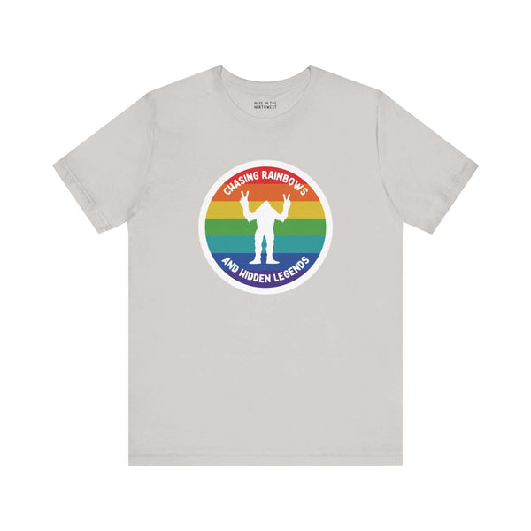 Chasing Rainbows Sasquatch Soft Tee Celebrate your roots with a splash of color and a touch of mystery in our "Hometown Pride" tee. Featuring a vibrant rainbow circle and a playful Sasquatch graphic, this shirt embodies the unique and spirited vibe of the