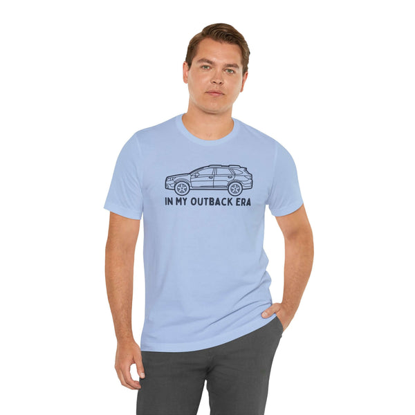 Man wearing 'In My Outback Era' soft tee featuring a Subaru Outback design, showcasing PNW lifestyle.