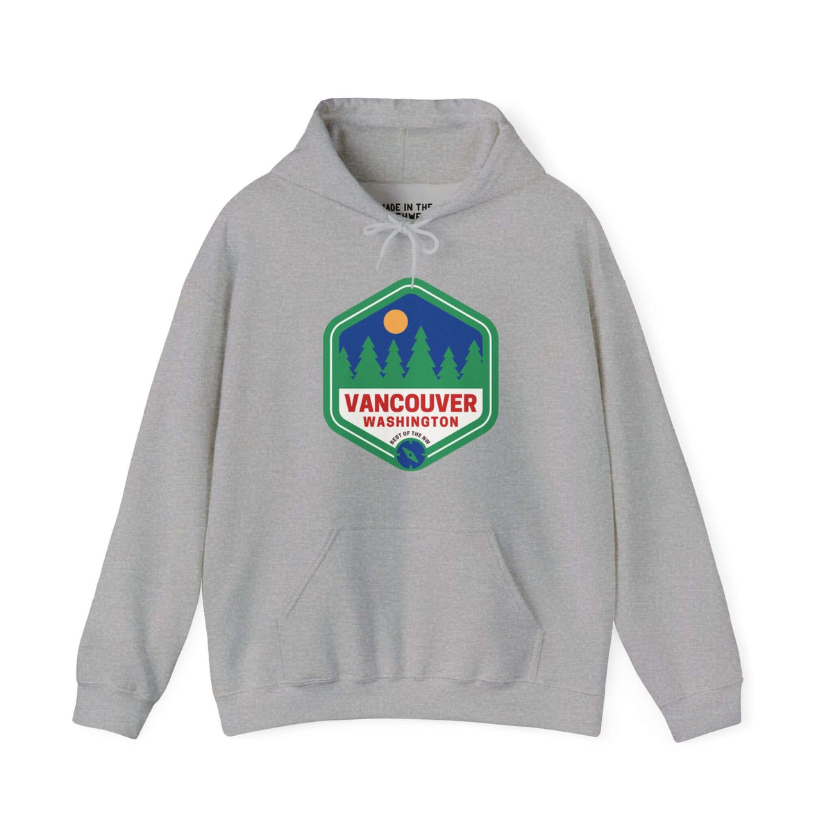 Gray Vancouver hoodie with retro 90s-inspired badge, featuring trees symbolizing Northwest charm and community spirit.