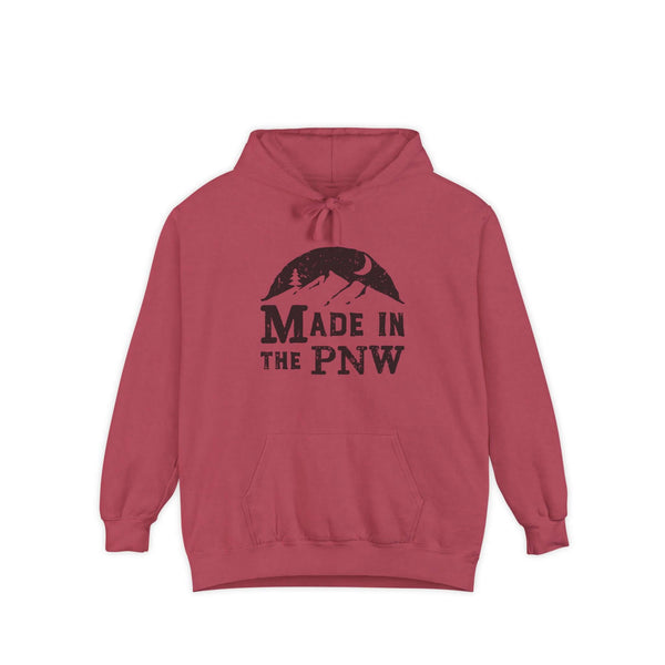 Made in the PNW hoodie in a cozy red color featuring a mountain and forest design.