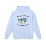Light blue hoodie with playful graphic saying 'Sorry for What I Said Before Coffee' and cartoon coffee characters.