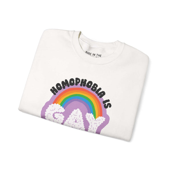 Cozy white sweatshirt with 'Homophobia is Gay' graphic featuring a rainbow and clouds design.