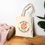 We're All a Little Bit Gay tote bag displayed with a playful design, perfect for expressing pride and joy.