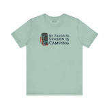 My Favorite Season is Camping Tee featuring a camping backpack design on a light blue shirt.