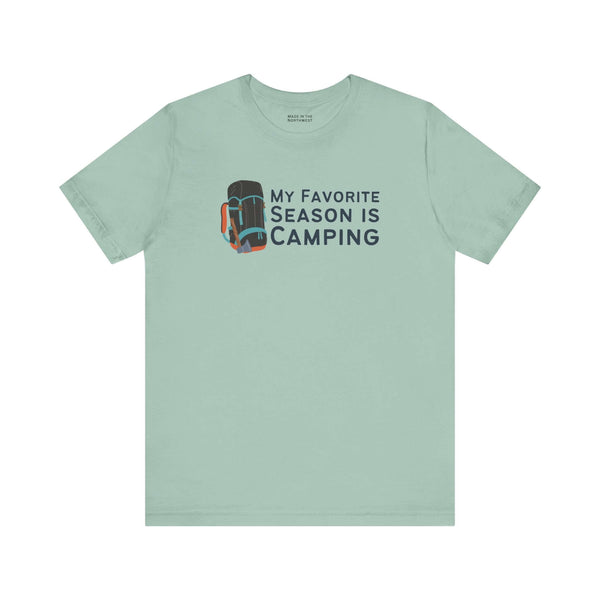 My Favorite Season is Camping Tee featuring a camping backpack design on a light blue shirt.