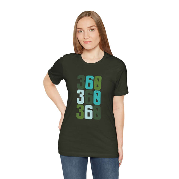 Model wearing Three-Six-Oh Pop Premium Soft Tee with vibrant 360 area code design in greens and blues.