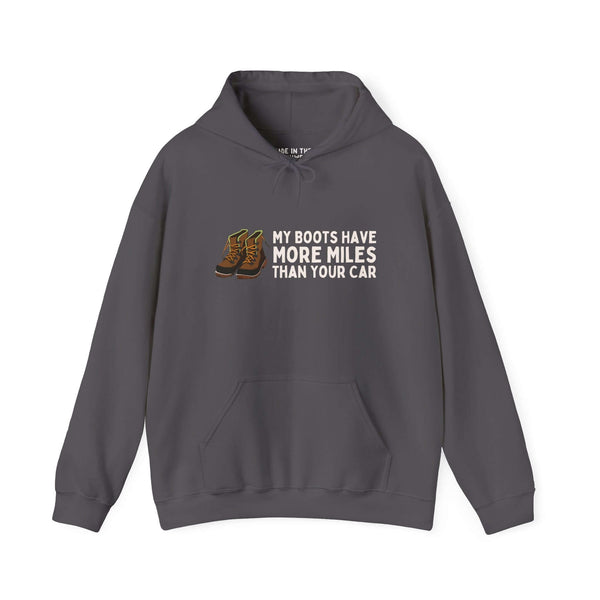 Unisex hoodie featuring 'My Boots Have More Miles Than Your Car' design, ideal for hikers and outdoor enthusiasts.