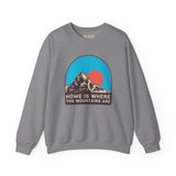 Gray sweatshirt featuring a graphic of mountains and a sun with the words 