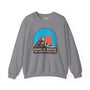 Gray sweatshirt featuring a graphic of mountains and a sun with the words "Home is Where the Mountains Are" in bold text.