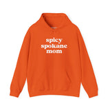 Orange hoodie with 'Spicy Spokane Mom' text, perfect for active moms who enjoy local adventures and cozy comfort.