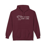 Messy Hair Don't Care Hoodie featuring playful Sasquatch design on a burgundy background.
