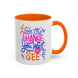 Be the Change You Want to See Mug in colorful design with orange handle and interior for inspirational sipping.