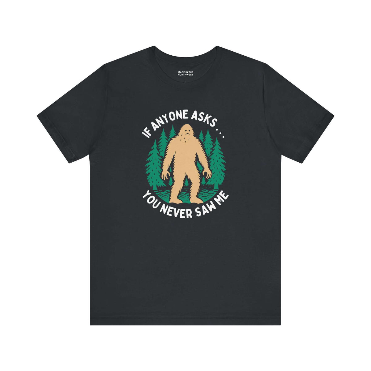 You Never Saw Me Tee featuring Bigfoot silhouette and forest trees graphic on black shirt.