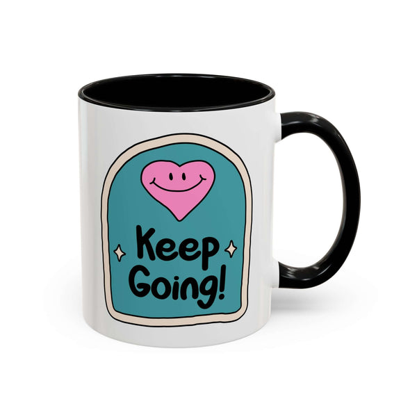 Keep Going Mug featuring a whimsical design with a smiling heart and hand-lettered message.