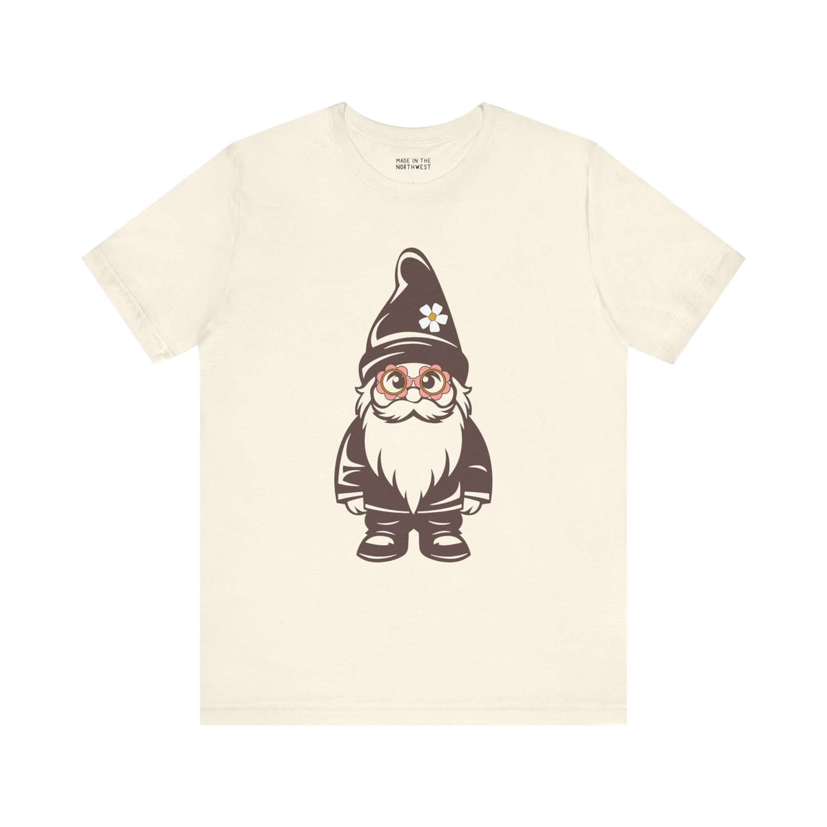 Beige tee featuring a cartoon hippie gnome with daisy glasses and hat, showcasing playful PNW style.