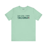 Two Five Three Tacoma soft tee featuring axe and tree design, celebrating hometown pride with stylish charm and local spirit.