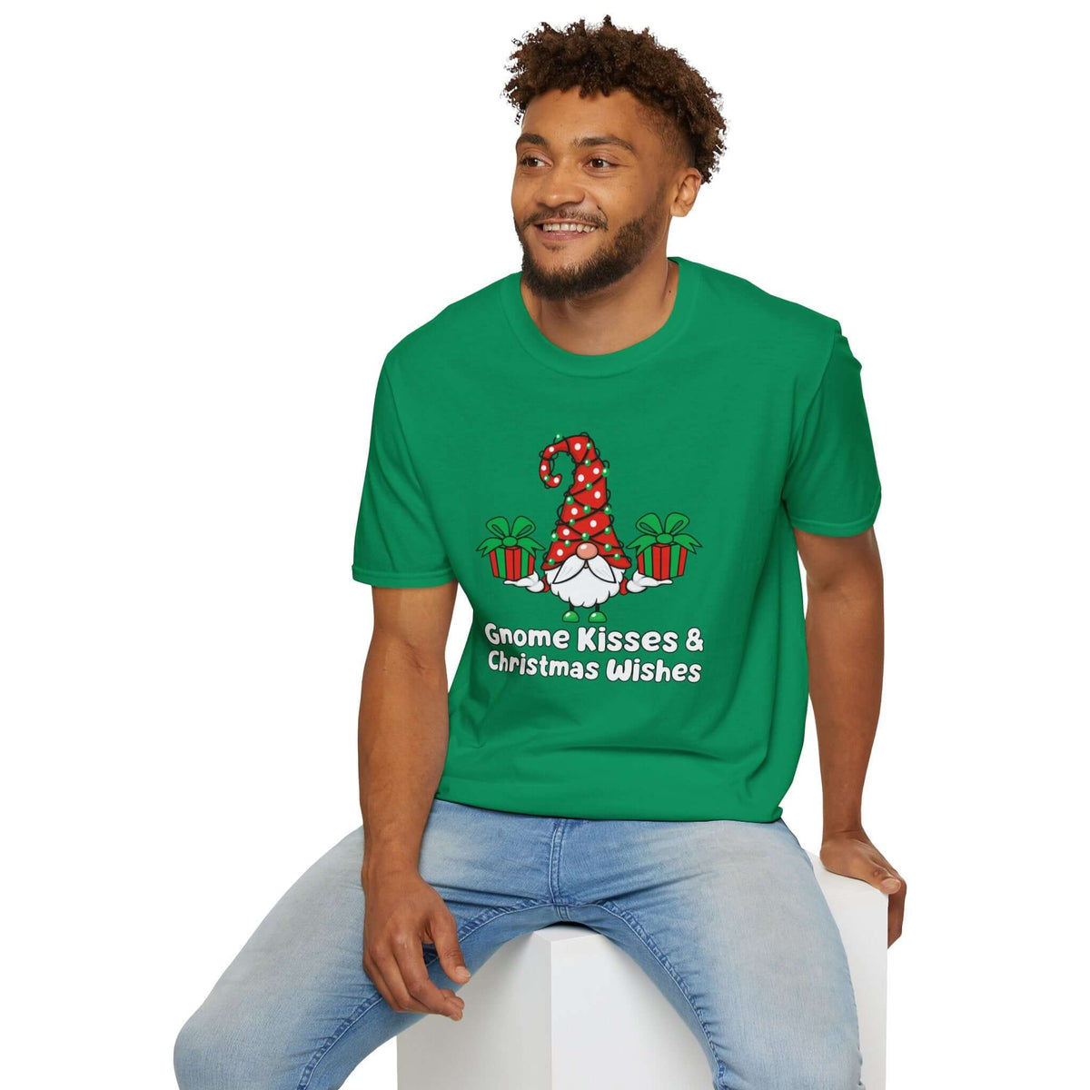 Person wearing a green Gnome Kisses and Christmas Wishes T Shirt with a cheery gnome and presents design.