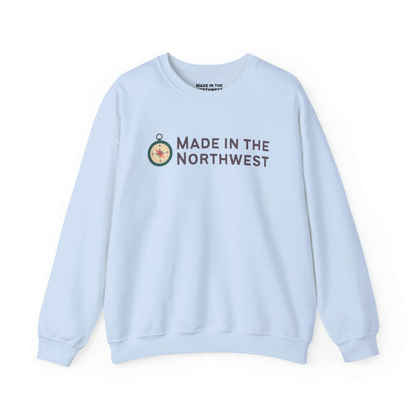 Light blue Made in the Northwest Sweatshirt featuring a compass graphic and logo.