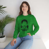 Model wearing green 'Vantucky Proud' sweatshirt featuring Rusty McCoy graphic with a plant in the background.