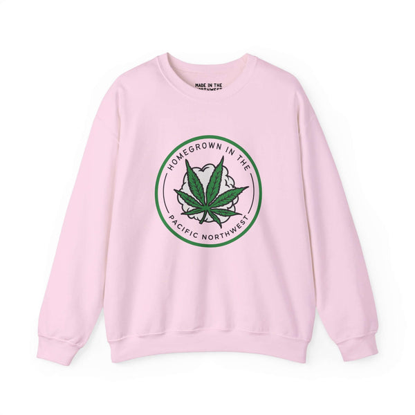 Pink sweatshirt featuring a marijuana leaf and "Homegrown in the Pacific Northwest" text, celebrating PNW lifestyle.