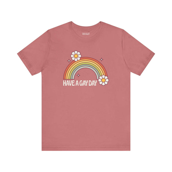 Have a Gay Day T Shirt featuring a rainbow and daisies, perfect for uplifting LGBTQ+ pride and positivity.