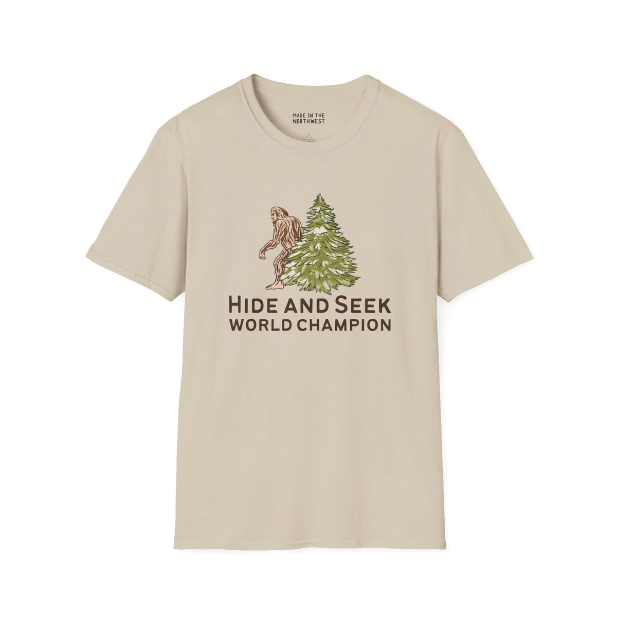 Hide and Seek World Champion Bigfoot Softstyle T-Shirt featuring Sasquatch behind a tree.
