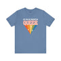 Blue premium soft tee featuring 'Let Me Be Perfectly Queer' graphic with rainbow diamond design.