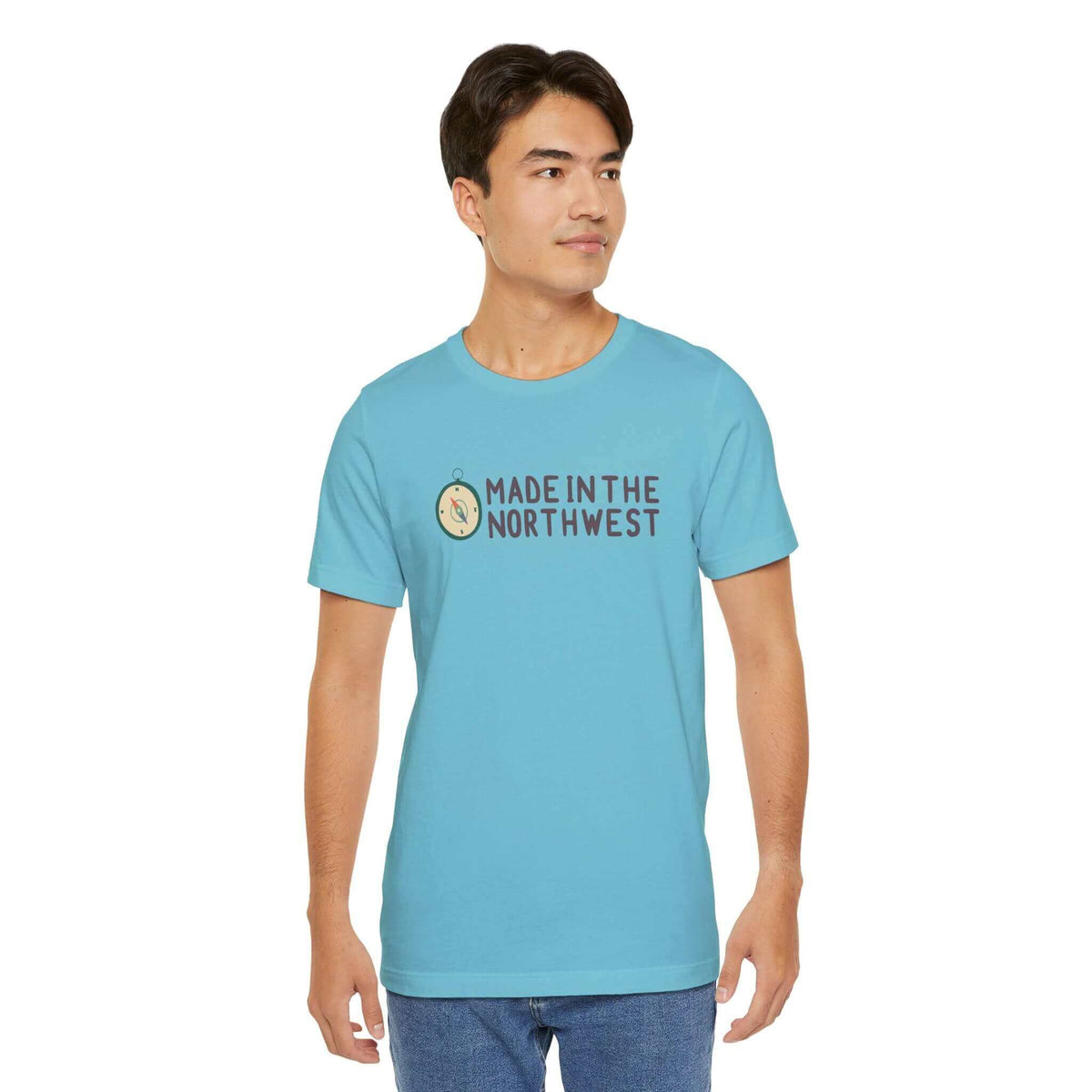 "Pacific Northwest pride tee with compass design and 'Made in the Northwest' logo in turquoise, perfect for adventurers."