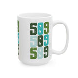 Five-Oh-Nine Pop Spokane ceramic mug featuring colorful stacked design celebrating 509 pride.