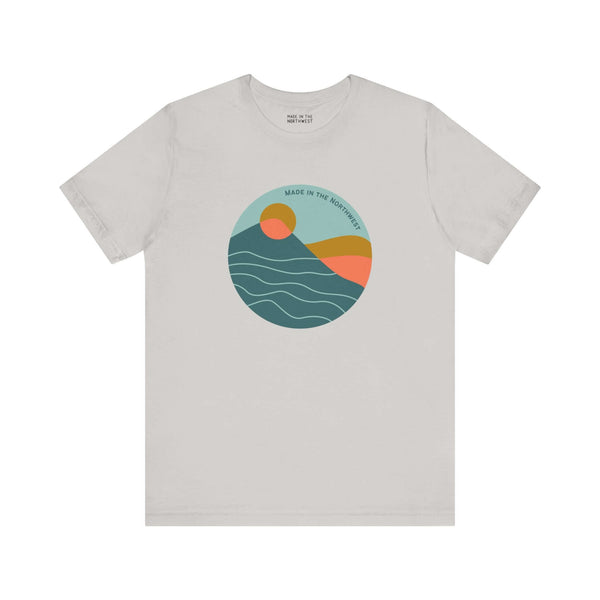 Pacific Peaks Modern Circle Soft Tee with mountain scene design in a circle, featuring muted colors, inspired by the Pacific Northwest.