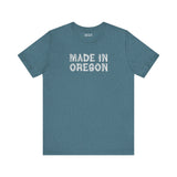 Premium soft tee featuring 'Made in Oregon' in rustic log font, perfect for outdoor enthusiasts.