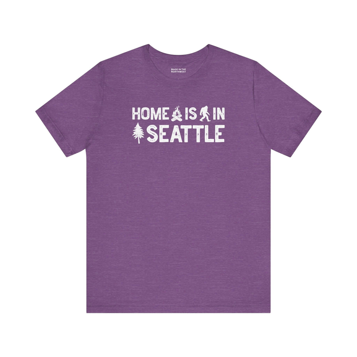 Home Is in Seattle Tee featuring a design with trees and Bigfoot in purple for Emerald City pride.