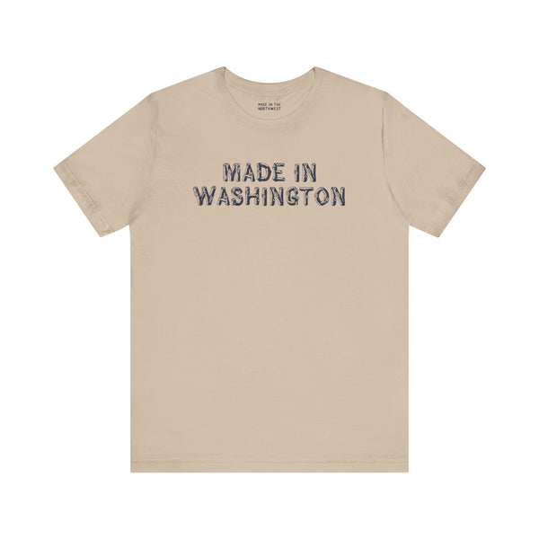 Beige tee with 'Made in Washington' in bold wood log font, celebrating Pacific Northwest pride.
