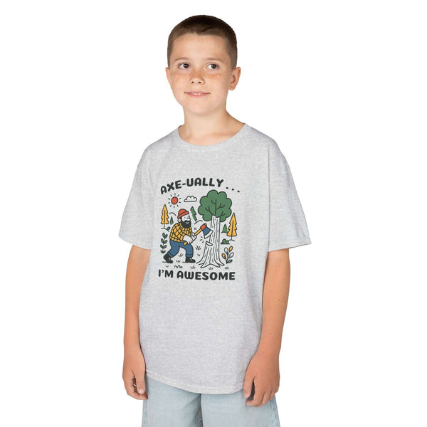 Axeually I'm Awesome Kids T Shirt worn by a smiling boy, featuring a playful lumberjack and tree design.