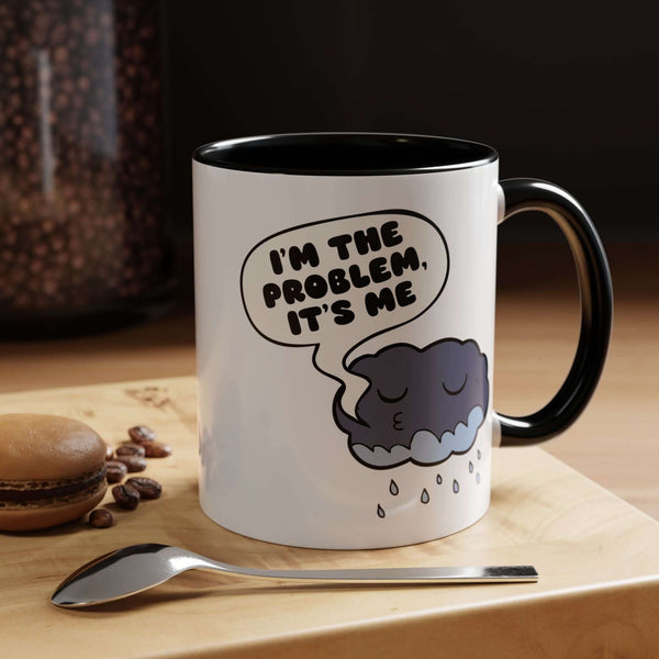 I'm the Problem, It's Me Mug featuring a sleepy cloud design on a glossy white and black ceramic mug.