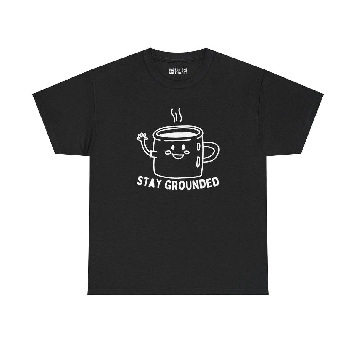 Black tee with cute illustrated coffee mug waving, text "Stay Grounded," perfect for coffee lovers seeking comfort and style.