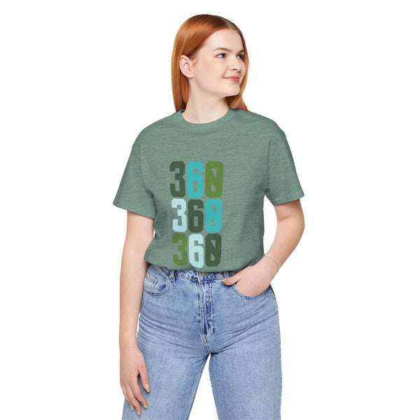 Woman wearing Three-Six-Oh Pop Premium Soft Tee with colorful 360 design representing Pacific Northwest pride.