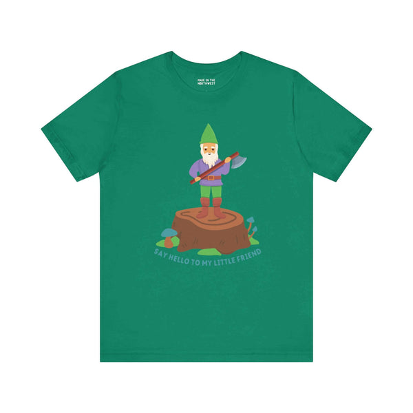 Green tee featuring a gnome with an axe on a stump, text 'Say hello to my little friend', mixing humor and bold style.