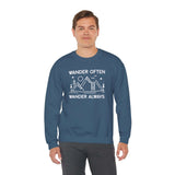 Wander Often Wander Always Sweatshirt modeled by a man, featuring a mountain and tent design with outdoor theme.