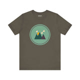 Olive green t-shirt with minimalist mountain and clouds design in a circle, inspired by the Pacific Northwest.