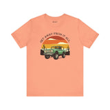 Get Away From It All vintage Bronco soft tee in coral featuring a classic Bronco and sunset design.