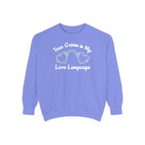 True crime is my love language sweatshirt in purple featuring heart-shaped handcuffs design.