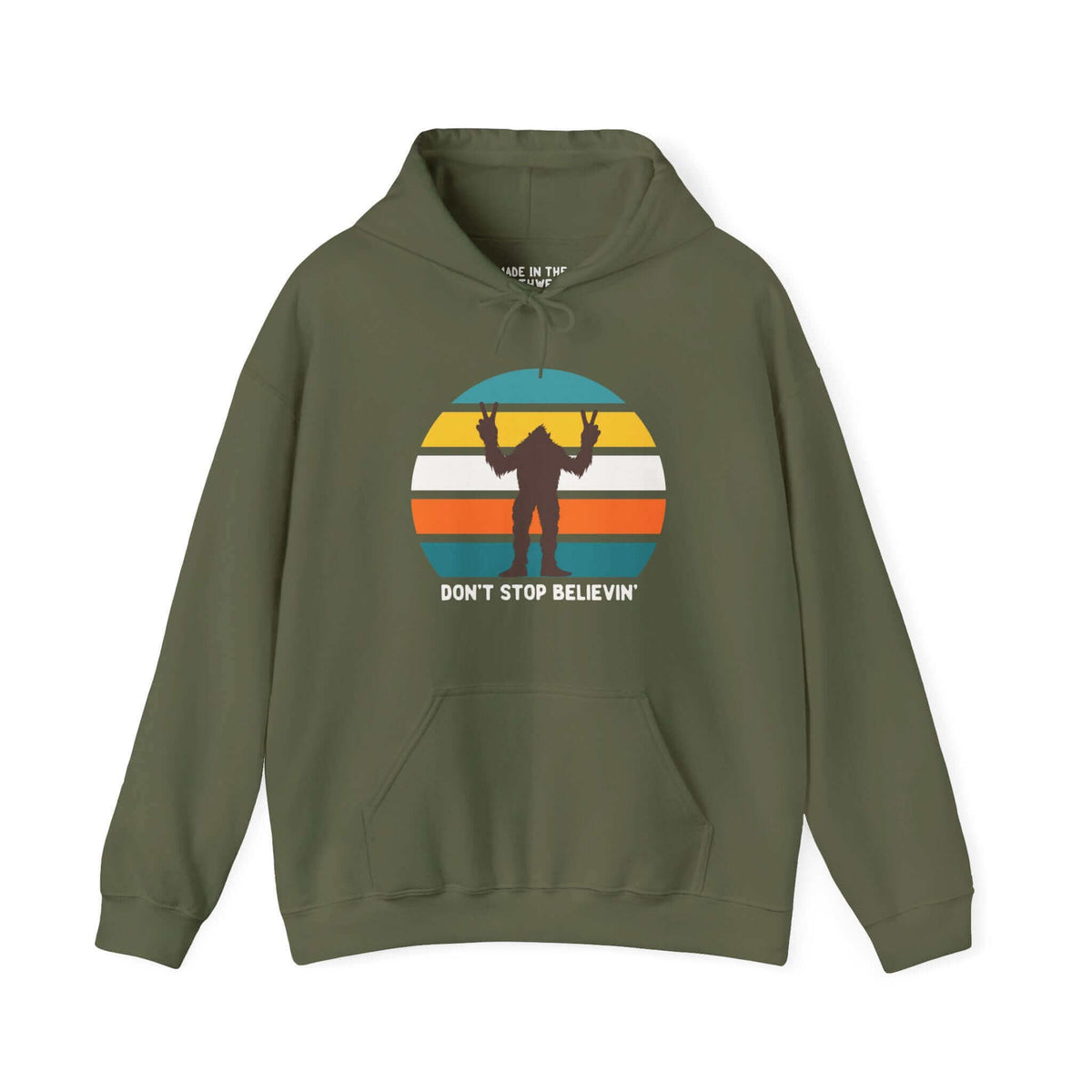 Green hoodie with "Don't Stop Believin'" Bigfoot graphic, inspired by Pacific Northwest folklore and adventure.