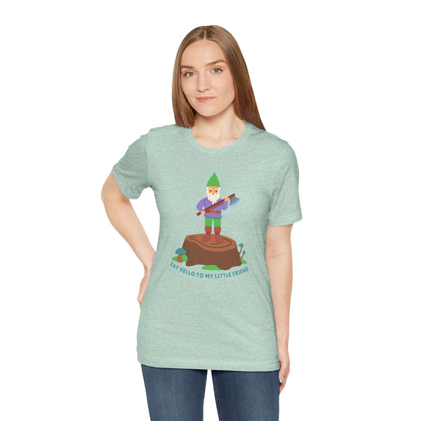 Model wearing a mint green tee with a gnome on a stump, captioned 'Say Hello to My Little Friend'.
