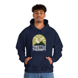 Man wearing Throttle Therapy hoodie with dirt biker graphic and mountain backdrop design. Perfect for motocross enthusiasts.