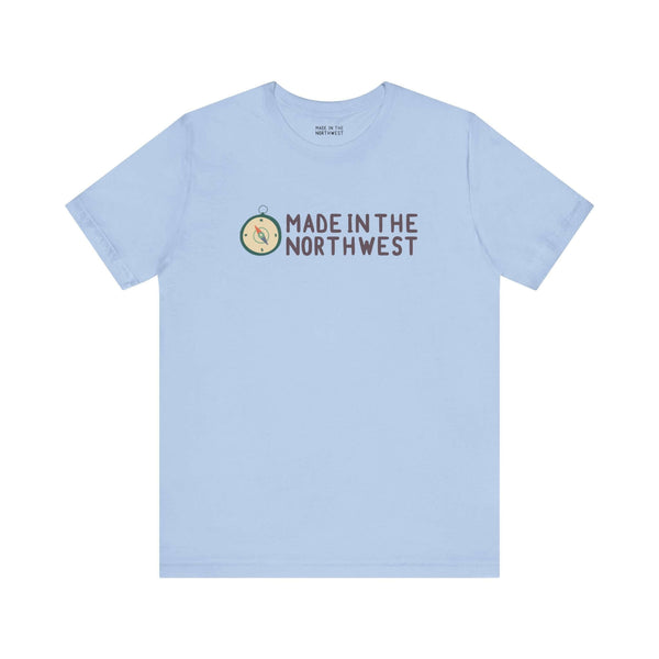 Light blue tee with 'Made in the Northwest' logo and compass design, perfect for Pacific Northwest enthusiasts and adventurers.