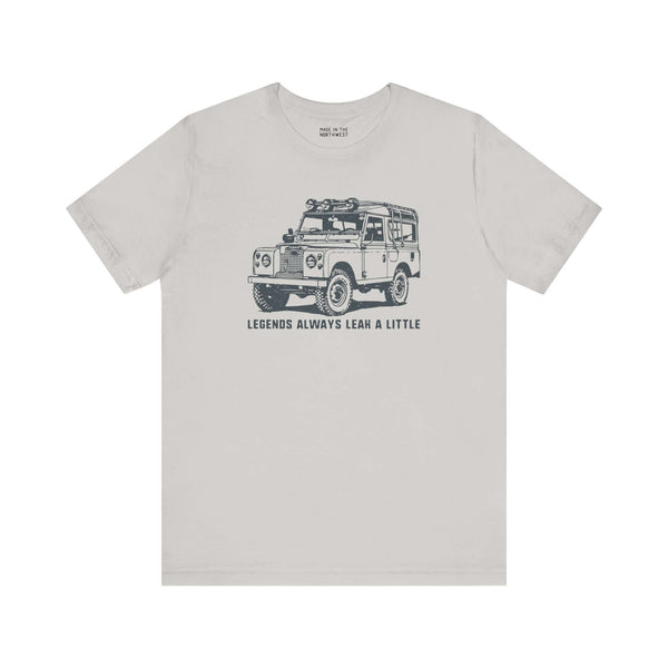 Legends Always Leak a Little tee featuring a vintage Land Rover Series II graphic on a soft cotton shirt.