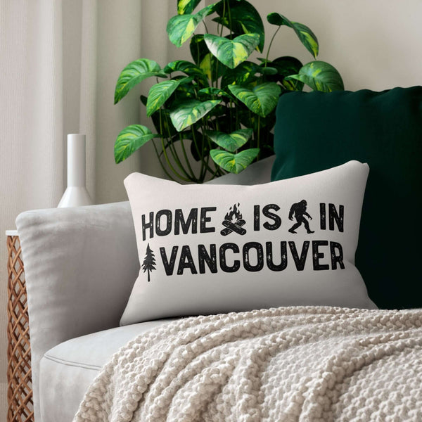 Home is in Vancouver Lumbar Accent Pillow showcasing campfire, Bigfoot, and tree design on a cozy couch.
